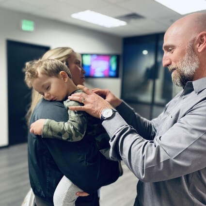 Dr Tuzzolino adjusting boy