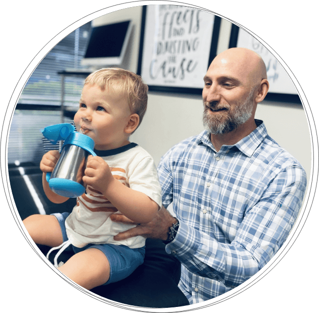 chiropractor adjusting toddler