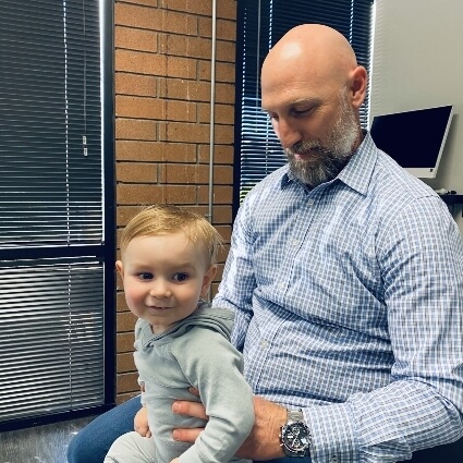 Dr Thomas adjusting toddlers back