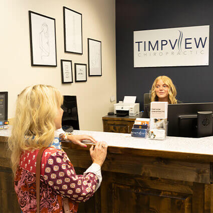 woman at reception desk