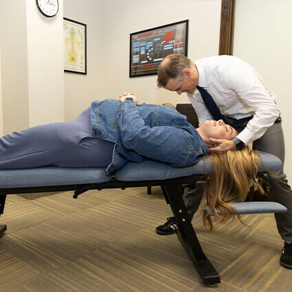 Adjusting patient's neck