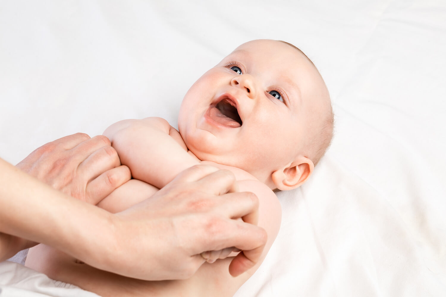 Baby receiving pediatric chiropractic adjustment