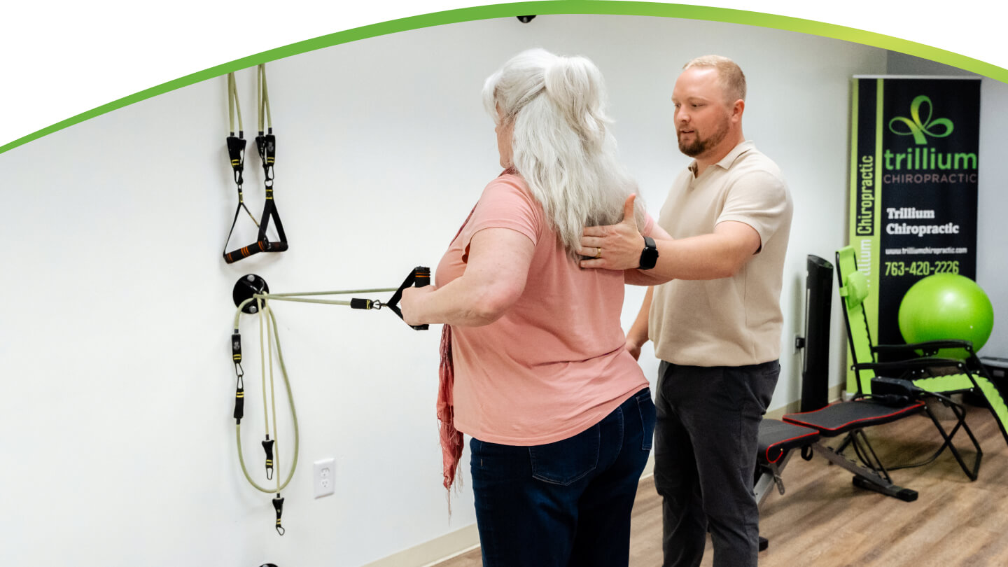 Dr. Tyler with hands on patient back