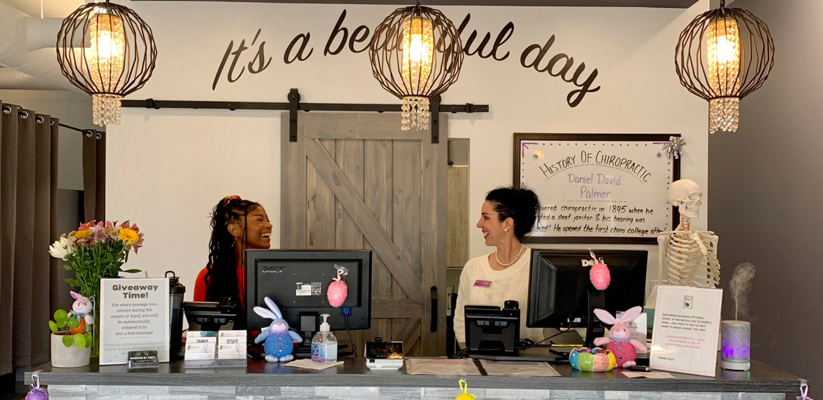 front desk staff smiling