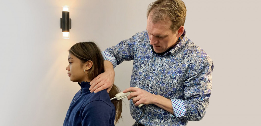 Dr. Don with female patient upper back adjustment