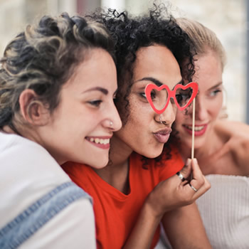 Young women having fun smiling groufie