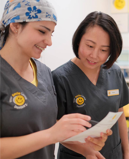 Staff looking at paper