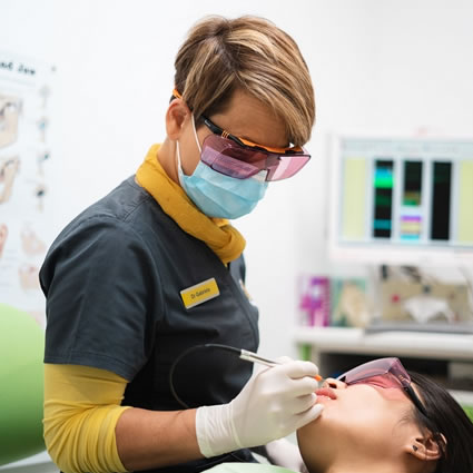 Dentist working on patient