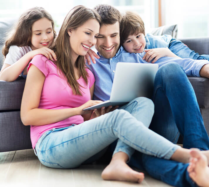 Family looking at computer