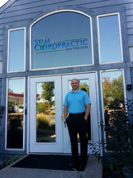 Dr. Eric Seim in front of building