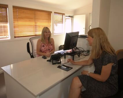 Patient at reception desk