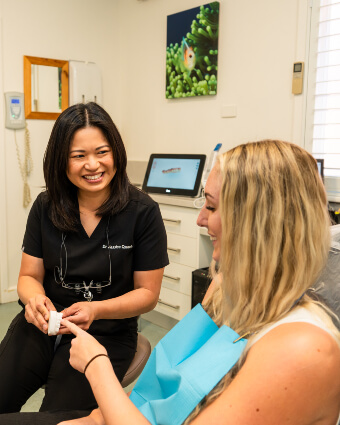 Perth dentist in consultation with a patient