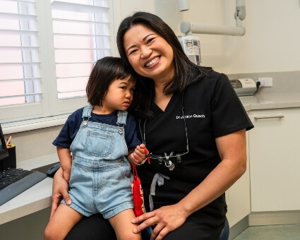Perth dentist posing with paediatric patient