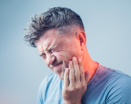 Man with severe dental pain
