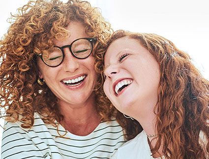 Mom and daughter laughing