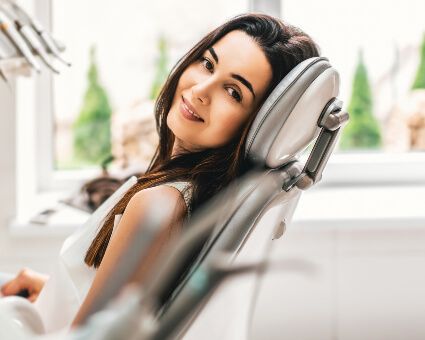 Female patient sitting on dental chair