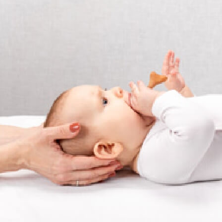 Chiropractor adjusting a paediatric patient