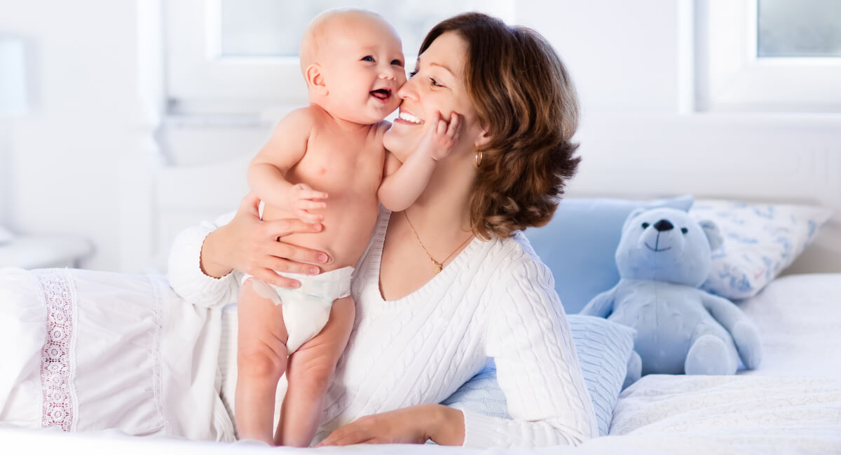 Smiling mom and baby
