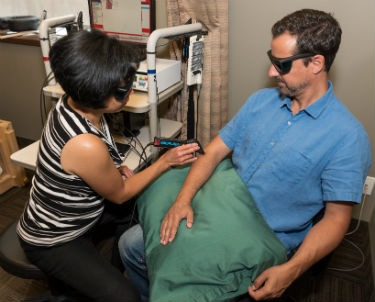 Laser therapy treatment on patient