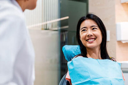 patient talking with dentist
