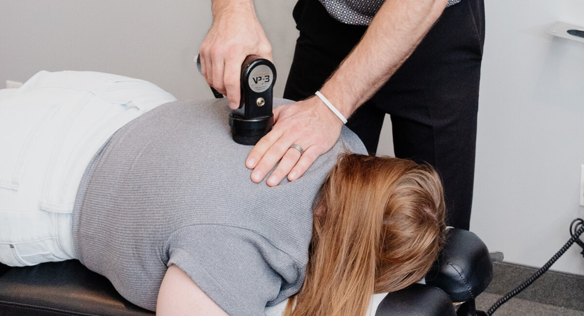 Female patient getting adjusted