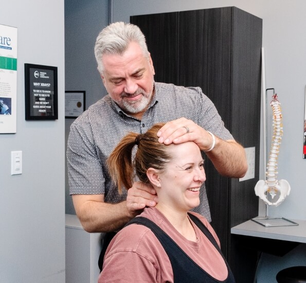 Dr. Brad adjusting patient