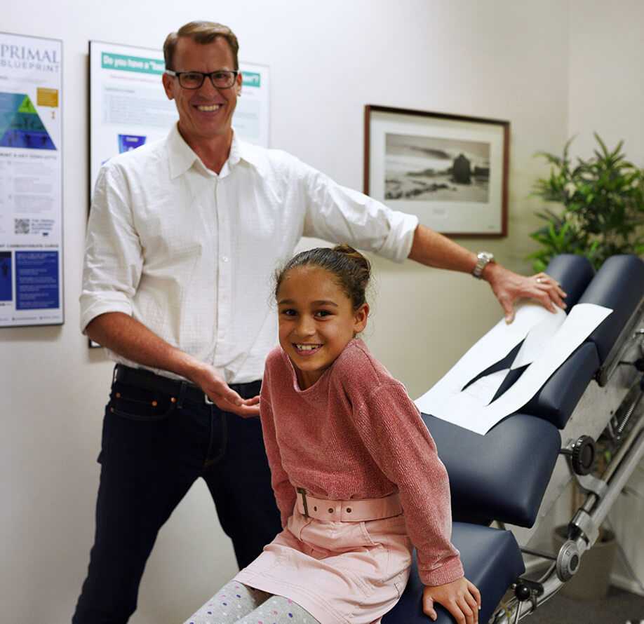 Chiropractor with child patient
