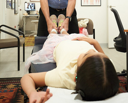 Dr Peterson with child patient at Cactus Chiropractic Lifestyle Centre