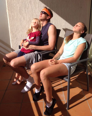 Dr. Brian and his daughters in the sun