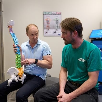 Dr Chris talking with patient