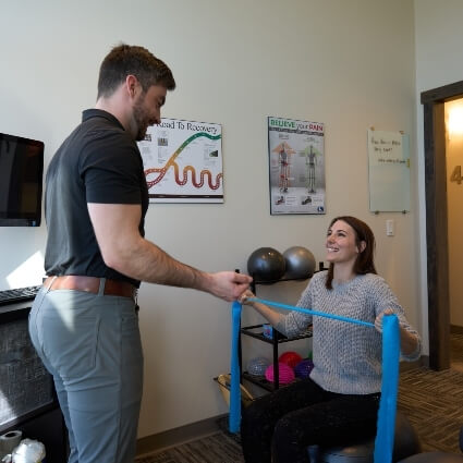 Dy Cody helping patient stretch