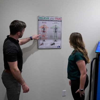 Dr Cody talking with Complete Health Chiropractic & Massage patient