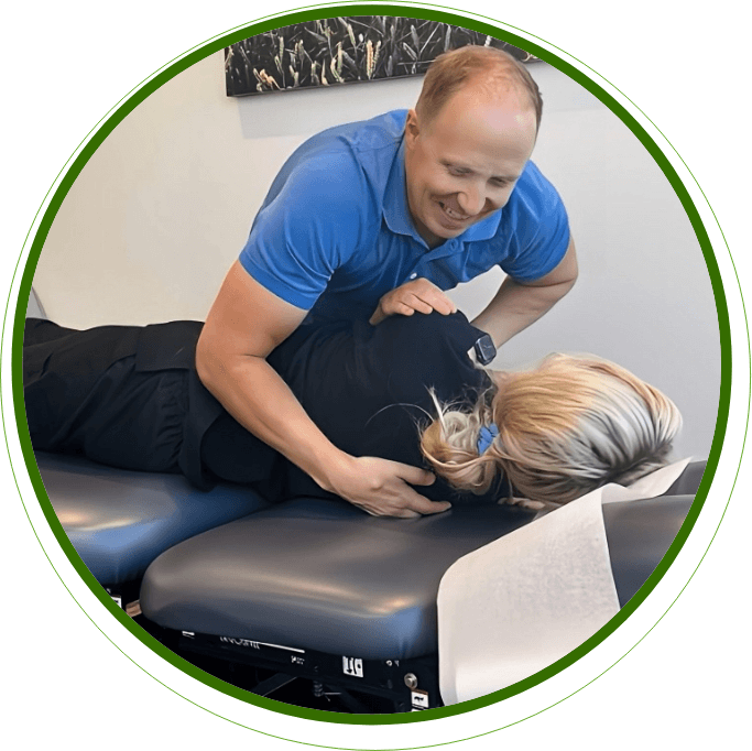Okotoks chiropractor Dr Christ adjusting patients back