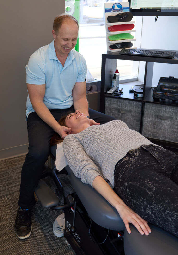 Dr Chris adjusting patients neck