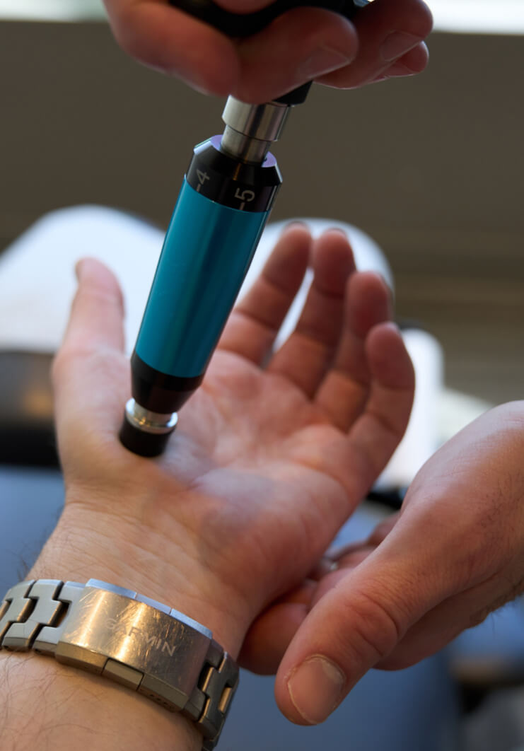 instrument adjustment on patients hand