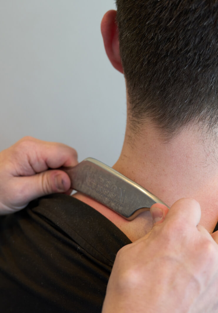 graston tool on patients neck