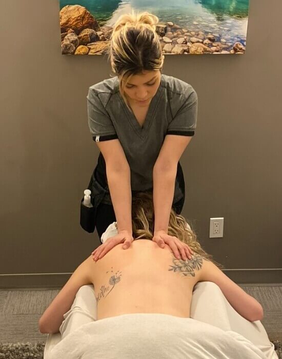 Okotoks massage therapist giving patient a massage