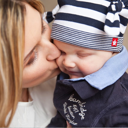 Mom and child kiss tenderly