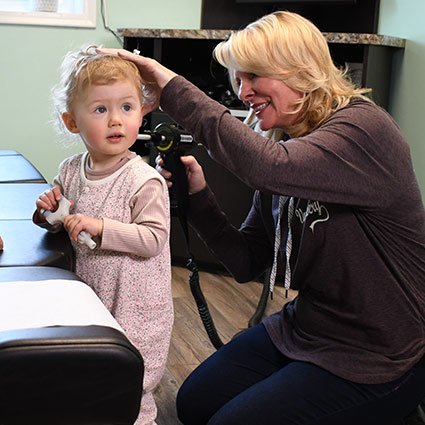 Dr Saylor adjusting child