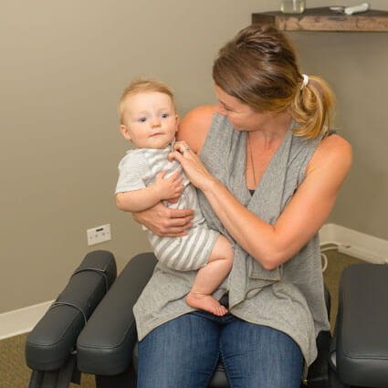 Carly holding baby