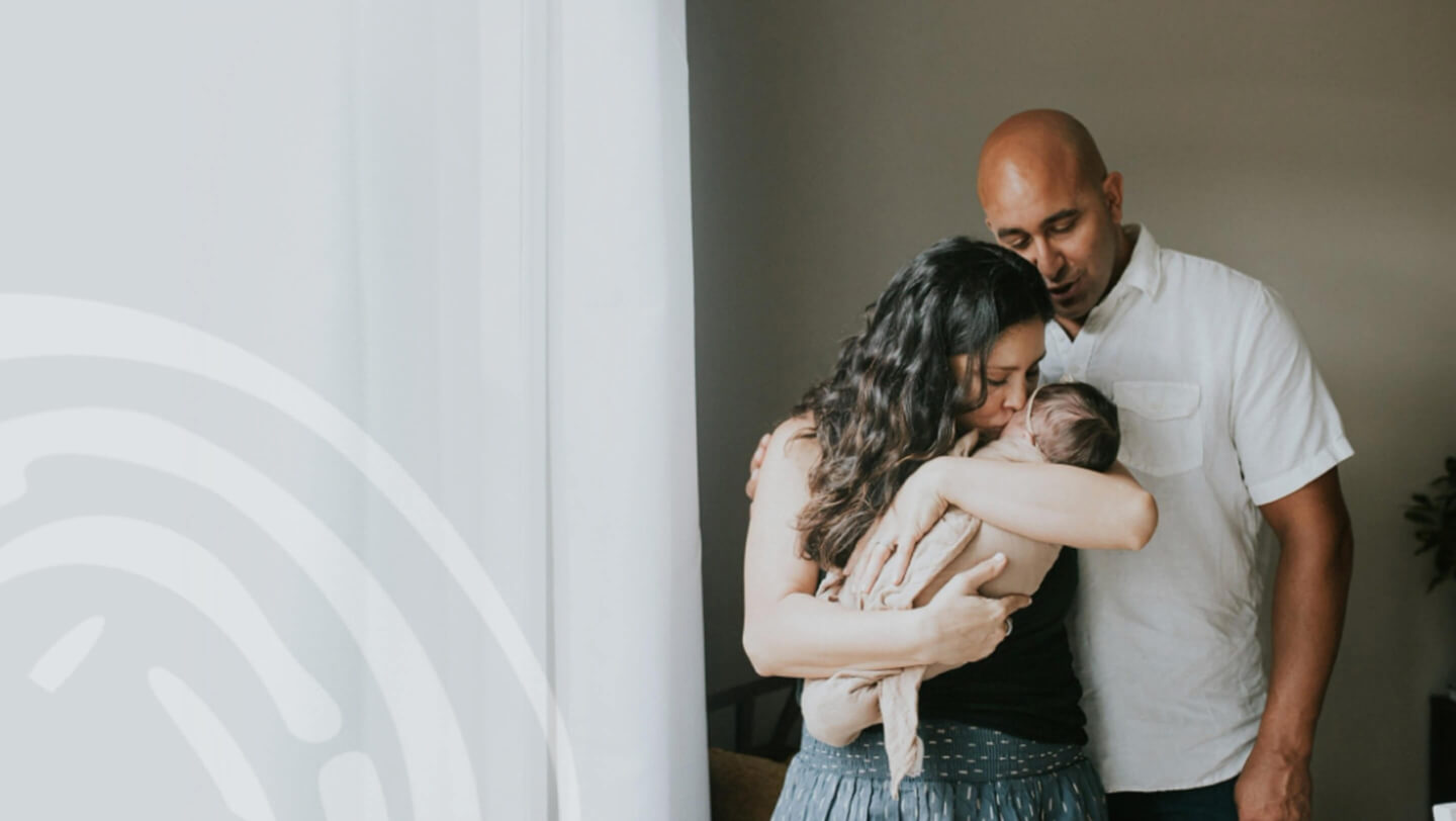 couple holding their baby