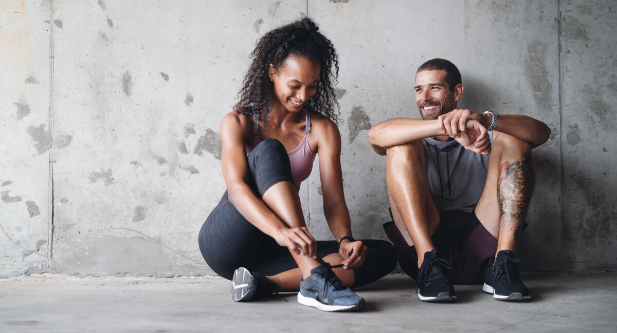Smiling male and female athlete