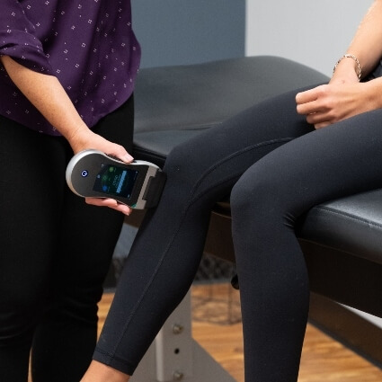 laser therapy on persons knee