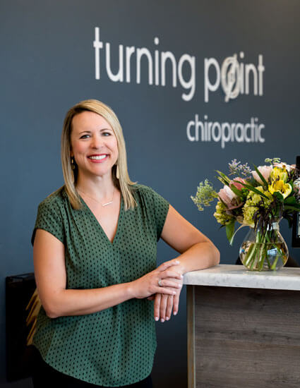 Dr. Leah standing near front desk