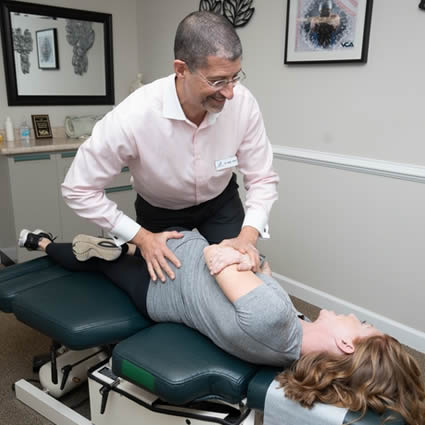 Williamsburg Chiropractor Dr. Shaye adjusting woman