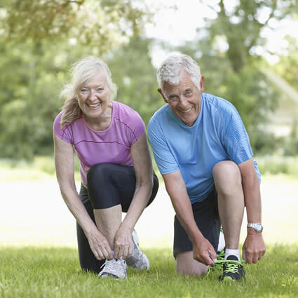 senior couple shoe lace