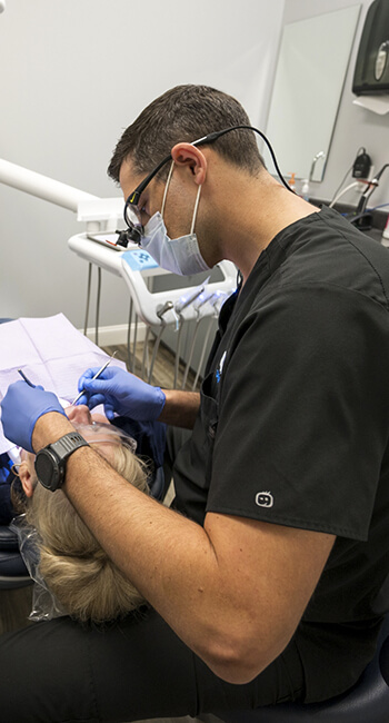 Dr. Jacobs performing dental procedure