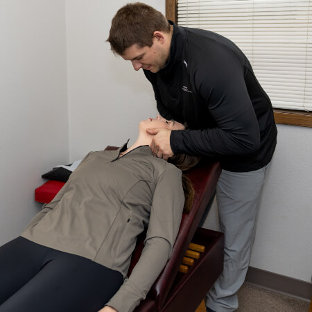 Morris chiropractor adjusting a patient's neck