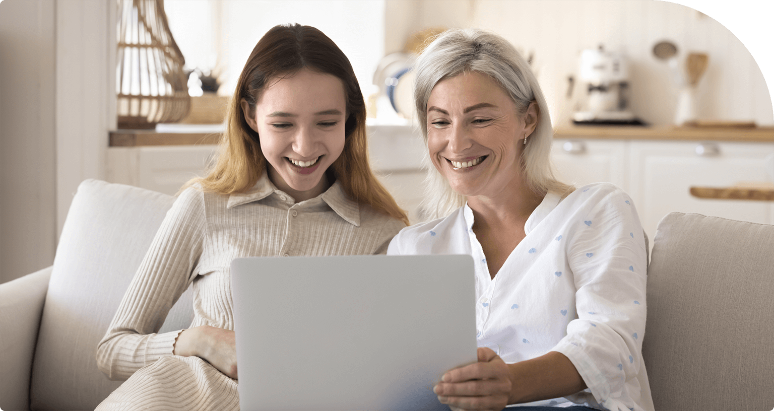 mother and daughter looking at computer