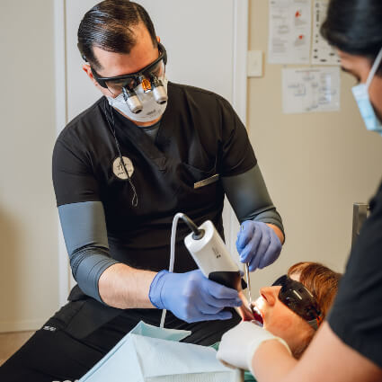 Dentist working on patient